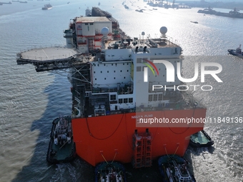 The NGUYA FLNG ship, China's first large floating natural gas liquefaction plant, sails on the Taicang section of the Yangtze River in Suzho...