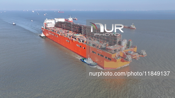 The NGUYA FLNG ship, China's first large floating natural gas liquefaction plant, sails on the Taicang section of the Yangtze River in Suzho...