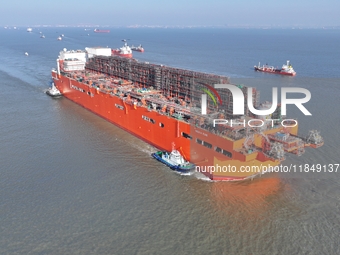 The NGUYA FLNG ship, China's first large floating natural gas liquefaction plant, sails on the Taicang section of the Yangtze River in Suzho...