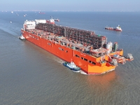 The NGUYA FLNG ship, China's first large floating natural gas liquefaction plant, sails on the Taicang section of the Yangtze River in Suzho...