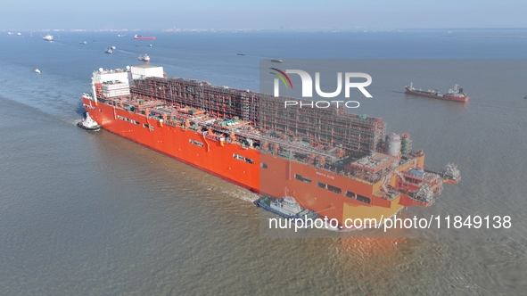 The NGUYA FLNG ship, China's first large floating natural gas liquefaction plant, sails on the Taicang section of the Yangtze River in Suzho...