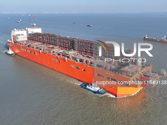 The NGUYA FLNG ship, China's first large floating natural gas liquefaction plant, sails on the Taicang section of the Yangtze River in Suzho...