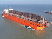 The NGUYA FLNG ship, China's first large floating natural gas liquefaction plant, sails on the Taicang section of the Yangtze River in Suzho...