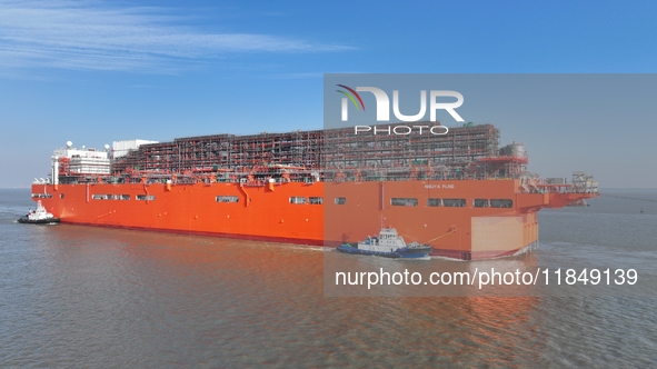 The NGUYA FLNG ship, China's first large floating natural gas liquefaction plant, sails on the Taicang section of the Yangtze River in Suzho...