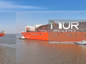 The NGUYA FLNG ship, China's first large floating natural gas liquefaction plant, sails on the Taicang section of the Yangtze River in Suzho...