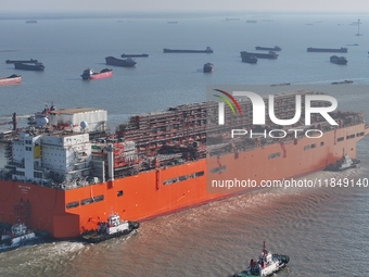 The NGUYA FLNG ship, China's first large floating natural gas liquefaction plant, sails on the Taicang section of the Yangtze River in Suzho...