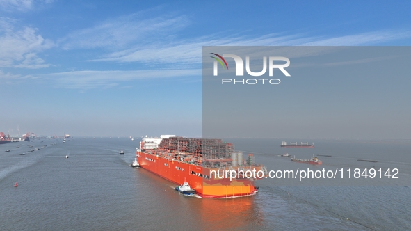 The NGUYA FLNG ship, China's first large floating natural gas liquefaction plant, sails on the Taicang section of the Yangtze River in Suzho...