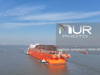 The NGUYA FLNG ship, China's first large floating natural gas liquefaction plant, sails on the Taicang section of the Yangtze River in Suzho...