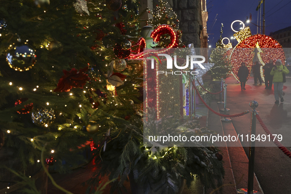 Christmas decorations and lights adorn the streets of Kharkiv, Ukraine, on December 7, 2024. 