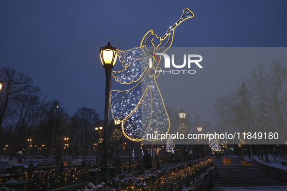 Angels with trumpets decorate lampposts during the Christmas season in Kharkiv, Ukraine, on December 7, 2024. 