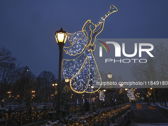 Angels with trumpets decorate lampposts during the Christmas season in Kharkiv, Ukraine, on December 7, 2024. (