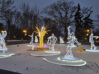 An installation featuring figures of ice skaters decorates the street during the Christmas season in Kharkiv, Ukraine, on December 7, 2024....