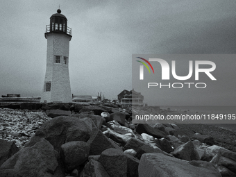 The Bates Lighthouse in Scituate greets a new day with the first snowfall of the year. (