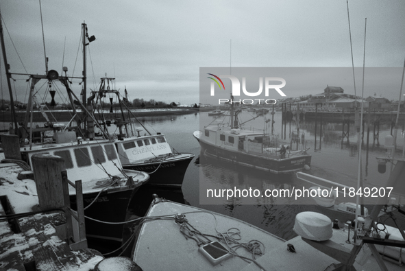 A ''long-liner'' fishing boat that seeks swordfish leaves Scituate Harbor early in the morning after a fresh snow. 