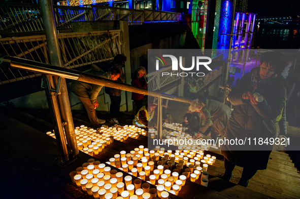 To commemorate World Candle Day, around 18,000 candles are lit in Nijmegen, The Netherlands, on December 8, 2024, to remember all deceased c...