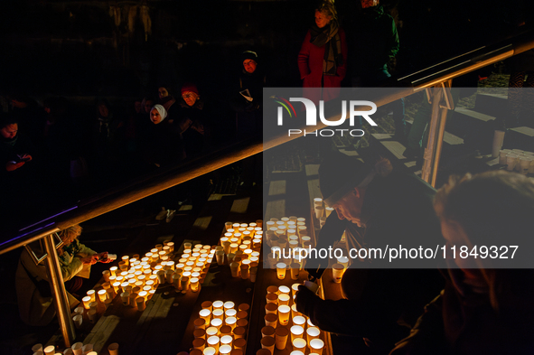 To commemorate World Candle Day, around 18,000 candles are lit in Nijmegen, The Netherlands, on December 8, 2024, to remember all deceased c...