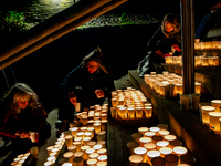 To commemorate World Candle Day, around 18,000 candles are lit in Nijmegen, The Netherlands, on December 8, 2024, to remember all deceased c...