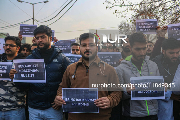 Bachelor of Medicine and Bachelor of Surgery (MBBS) students and doctors hold placards during a protest against excessive reservation in com...