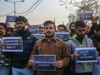 Bachelor of Medicine and Bachelor of Surgery (MBBS) students and doctors hold placards during a protest against excessive reservation in com...