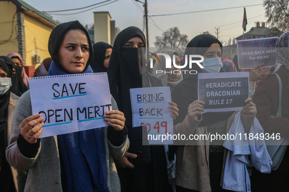 Bachelor of Medicine and Bachelor of Surgery (MBBS) students and doctors hold placards during a protest against excessive reservation in com...