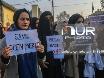 Bachelor of Medicine and Bachelor of Surgery (MBBS) students and doctors hold placards during a protest against excessive reservation in com...