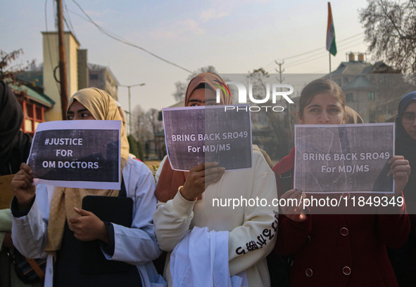 Students of Bachelor of Medicine and Bachelor of Surgery (MBBS) hold placards during a protest against excessive reservation in competitive...