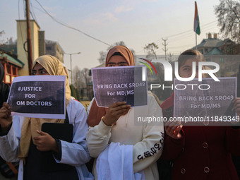 Students of Bachelor of Medicine and Bachelor of Surgery (MBBS) hold placards during a protest against excessive reservation in competitive...