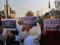 Students of Bachelor of Medicine and Bachelor of Surgery (MBBS) hold placards during a protest against excessive reservation in competitive...