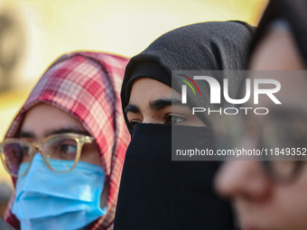 A student of Bachelor of Medicine and Bachelor of Surgery (MBBS) observes during a protest against excessive reservation in competitive exam...