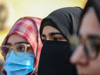 A student of Bachelor of Medicine and Bachelor of Surgery (MBBS) observes during a protest against excessive reservation in competitive exam...