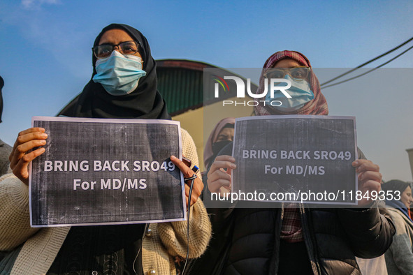 Students of Bachelor of Medicine and Bachelor of Surgery (MBBS) hold placards during a protest against excessive reservation in competitive...