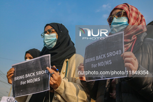 Students of Bachelor of Medicine and Bachelor of Surgery (MBBS) hold placards during a protest against excessive reservation in competitive...