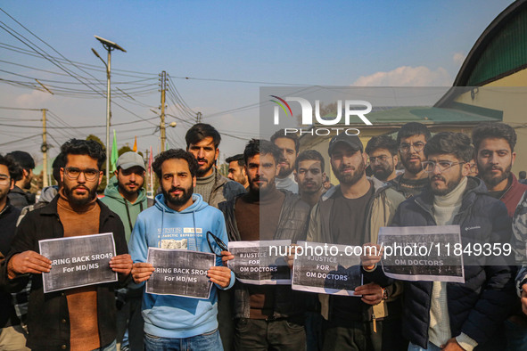 Bachelor of Medicine and Bachelor of Surgery (MBBS) students and doctors hold placards during a protest against excessive reservation in com...