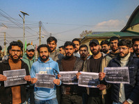 Bachelor of Medicine and Bachelor of Surgery (MBBS) students and doctors hold placards during a protest against excessive reservation in com...