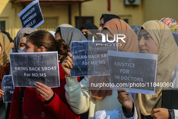 Students of Bachelor of Medicine and Bachelor of Surgery (MBBS) hold placards during a protest against excessive reservation in competitive...