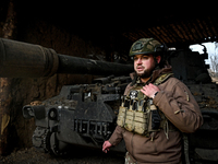 An artilleryman of Ukraine's 118th Separate Mechanized Brigade stands by a self-propelled howitzer while on a mission in the Zaporizhzhia di...