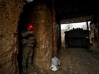 An artilleryman of Ukraine's 118th Separate Mechanized Brigade stands by a self-propelled howitzer while on a mission in the Zaporizhzhia di...