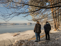 People enjoy a cold winter day at Lakes Osterseen in Iffeldorf, Bavaria, Germany, on January 14, 2024. Osterseen is a group of lakes in Bava...