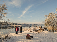 People enjoy a cold winter day at Lakes Osterseen in Iffeldorf, Bavaria, Germany, on January 14, 2024. Osterseen is a group of lakes in Bava...