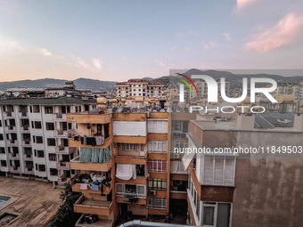 A view of dense housing development at sunset with mountains in the background is seen in Alanya, Turkey, on November 2, 2024 (