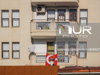 A portrait of Mustafa Kemal Ataturk hangs on the balcony of an apartment building in Alanya, Turkey, on November 3, 2024. (