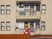 A portrait of Mustafa Kemal Ataturk hangs on the balcony of an apartment building in Alanya, Turkey, on November 3, 2024. (