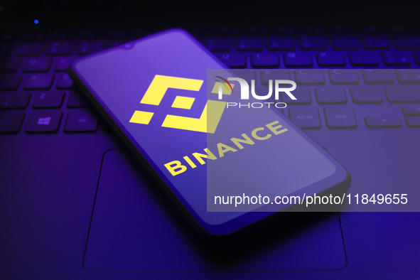 The logo of the cryptocurrency exchange Binance appears on the screen of a smartphone in Reno, United States, on December 9, 2024. 