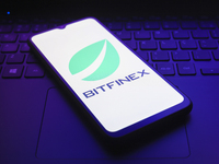 The logo of the cryptocurrency exchange Bitfinex appears on the screen of a smartphone in Reno, United States, on December 9, 2024. (