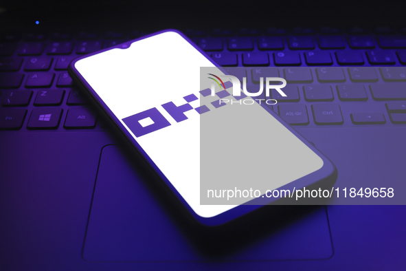 The logo of the cryptocurrency exchange OKX appears on the screen of a smartphone in Reno, United States, on December 9, 2024. 