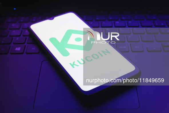 The logo of the cryptocurrency exchange KuCoin appears on the screen of a smartphone in Reno, United States, on December 9, 2024. 