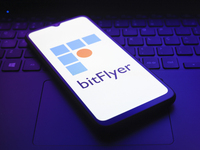 The logo of the cryptocurrency exchange bitFlyer appears on the screen of a smartphone in Reno, United States, on December 9, 2024. (