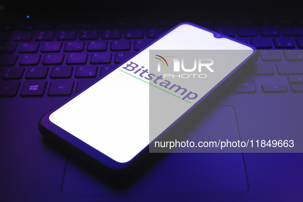 The logo of the cryptocurrency exchange Bitstamp appears on the screen of a smartphone in Reno, United States, on December 9, 2024. 