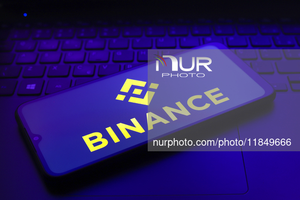 The logo of the cryptocurrency exchange Binance appears on the screen of a smartphone in Reno, United States, on December 9, 2024. 