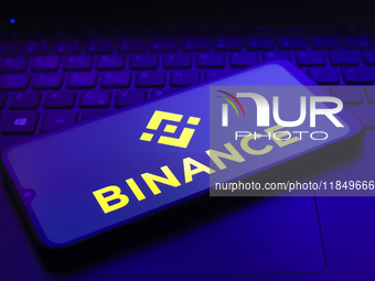 The logo of the cryptocurrency exchange Binance appears on the screen of a smartphone in Reno, United States, on December 9, 2024. (